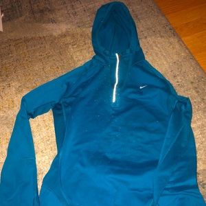 Nike womens sportswear with a hood.